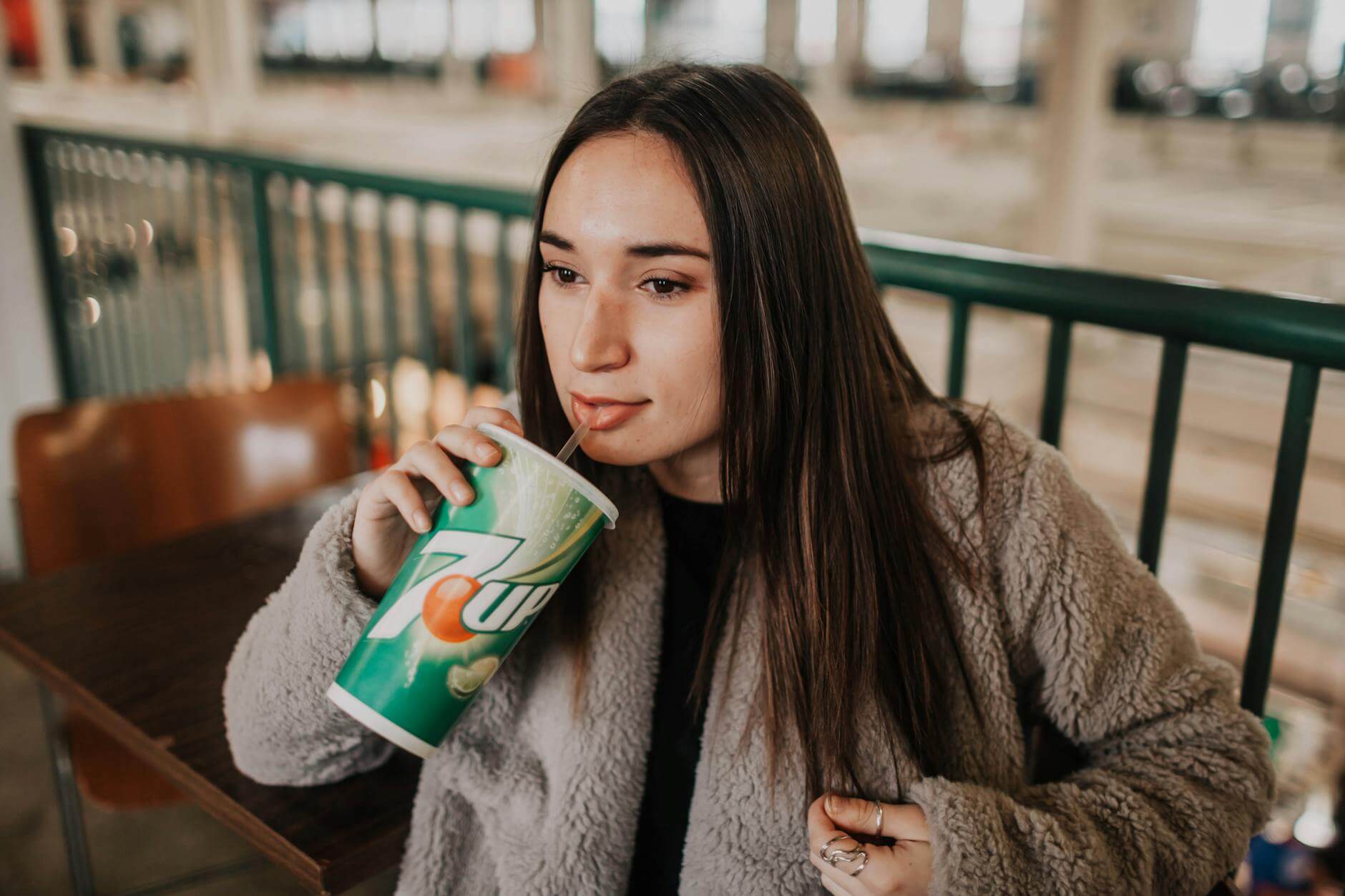 woman sipping soda