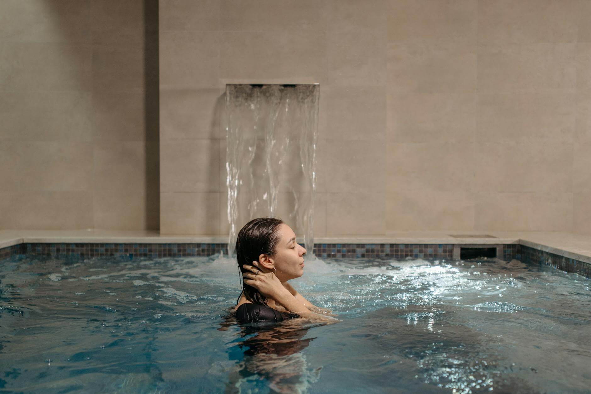 a woman bathing in a pool