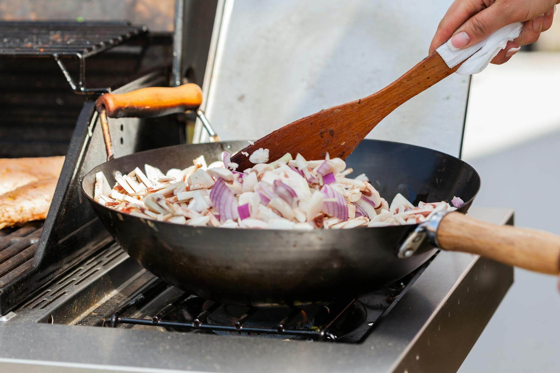 a person cooking using stove