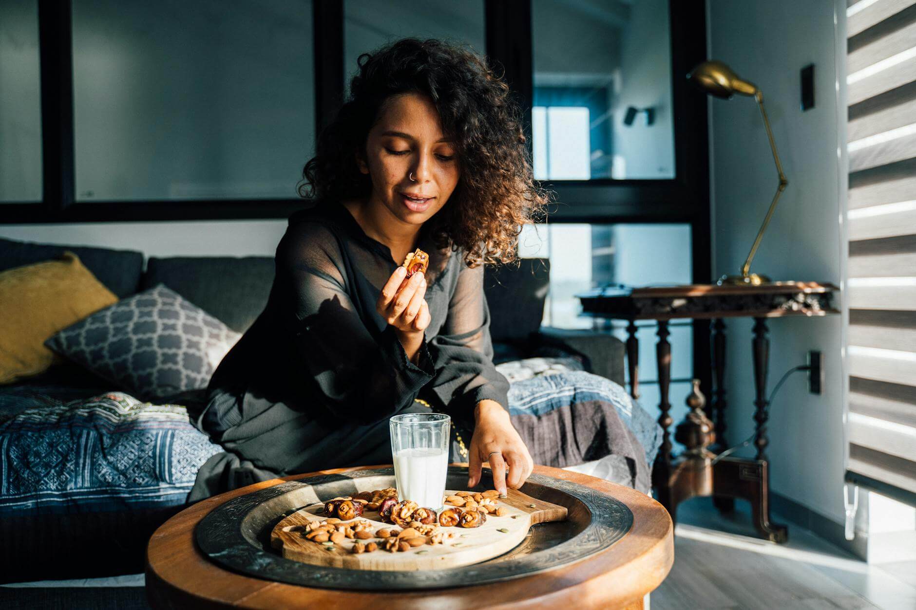 woman eating dates palm